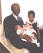 My grandfather, brother, twin sister and me
